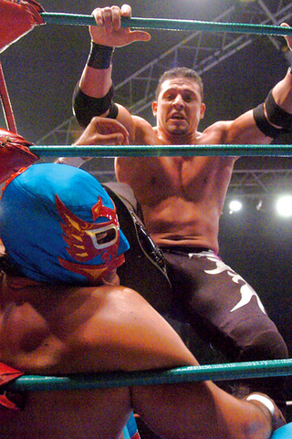Mexican wrestler Rey Mysterio Jr. absorbs a brutal hit during a non-televised WWE event.